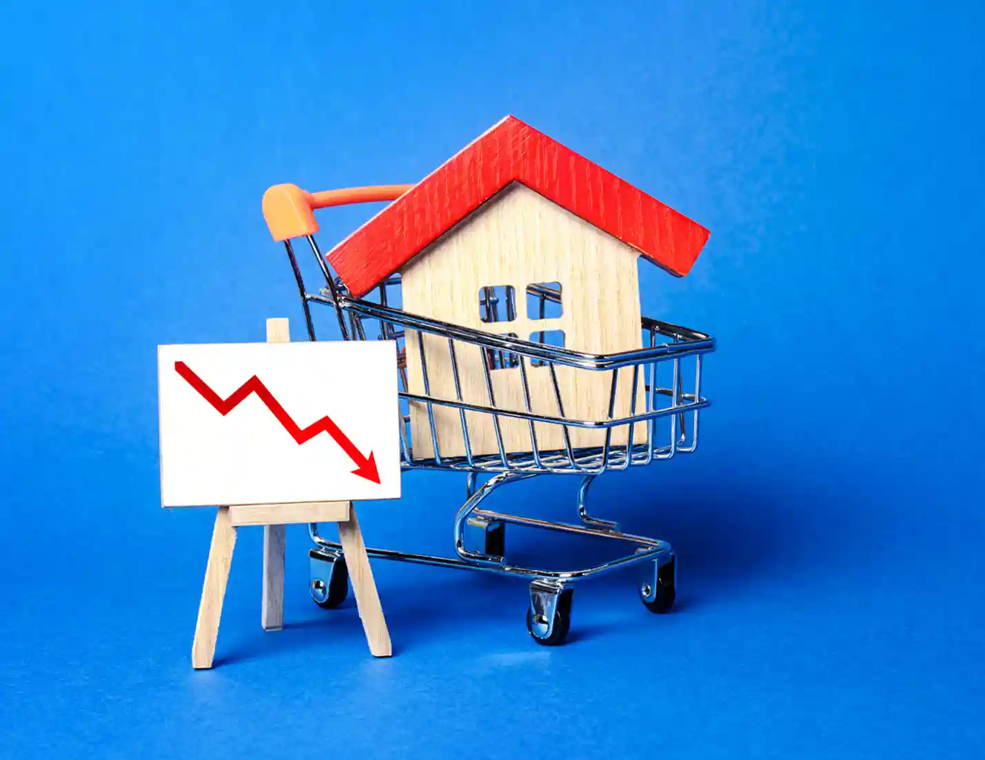 Wooden toy house in cart with a graph.