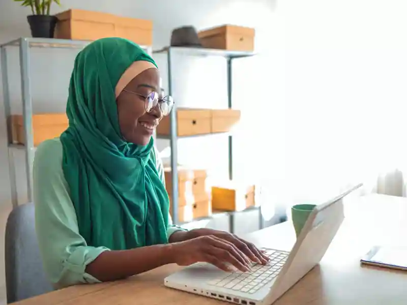 Woman using a laptop.