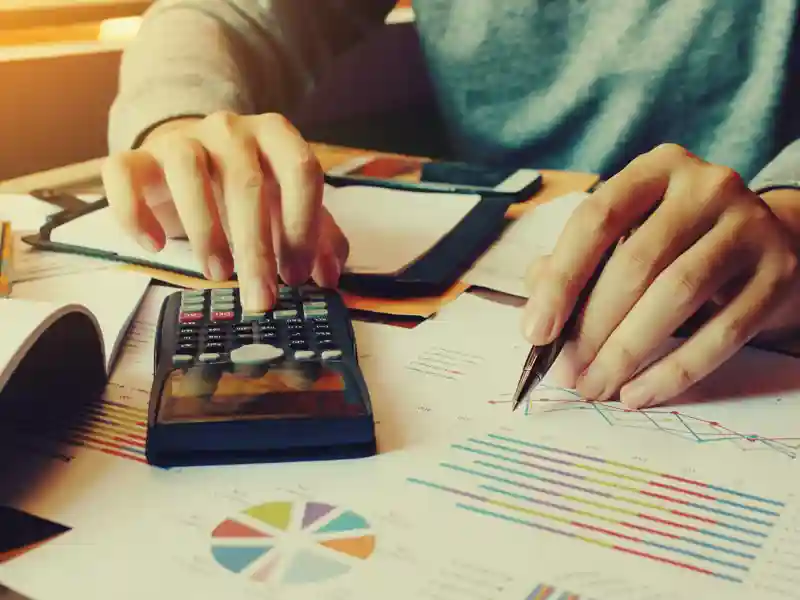 Businessman calculate finance and thinking about problem in home office.