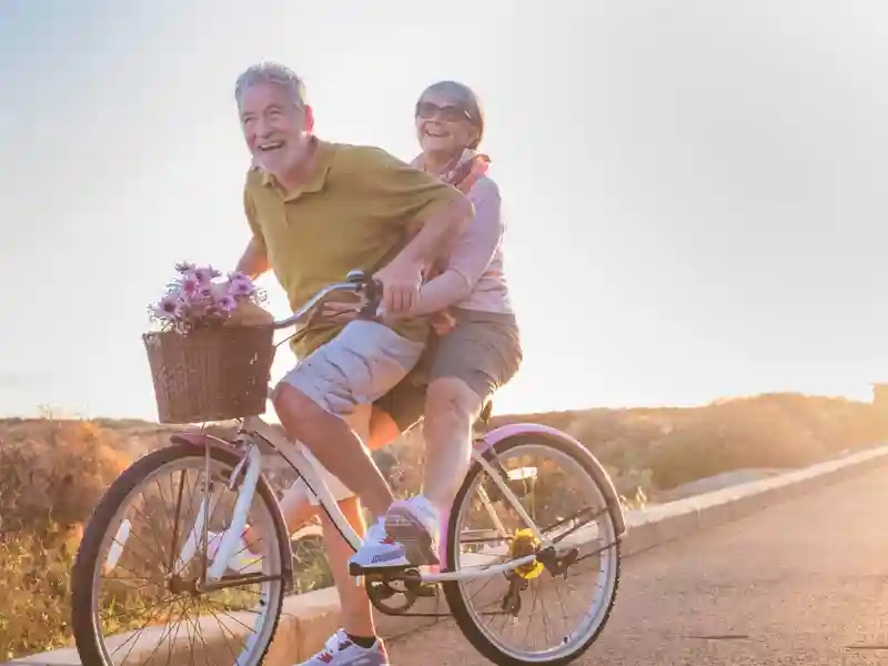 Older couple riding bicyle.