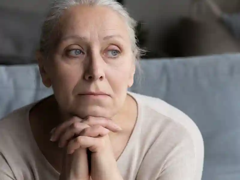 Thoughtful senior grandmother looking in distance.