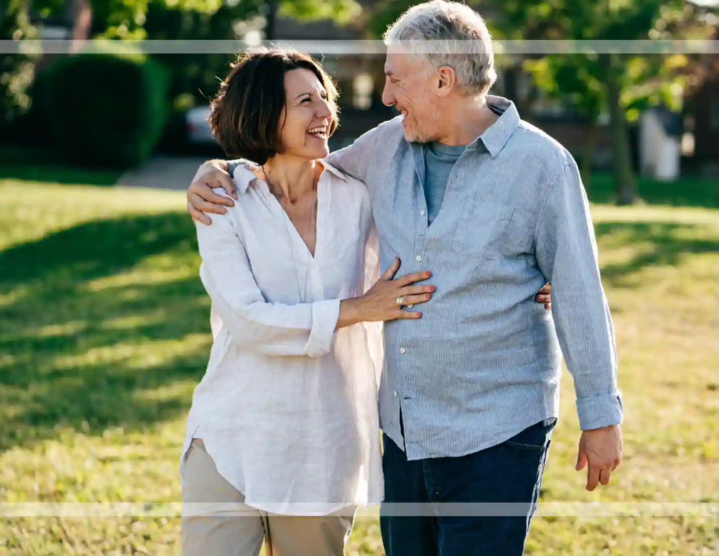 Mature couple walking in the park.