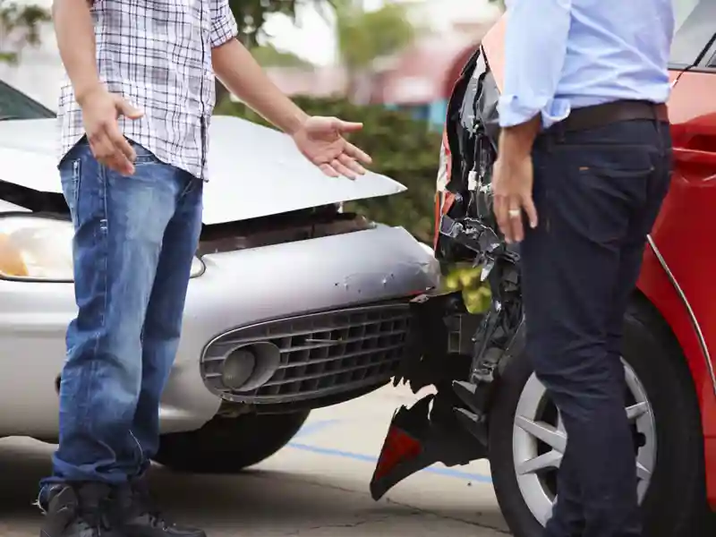 Two drivers arguing after a car accident.