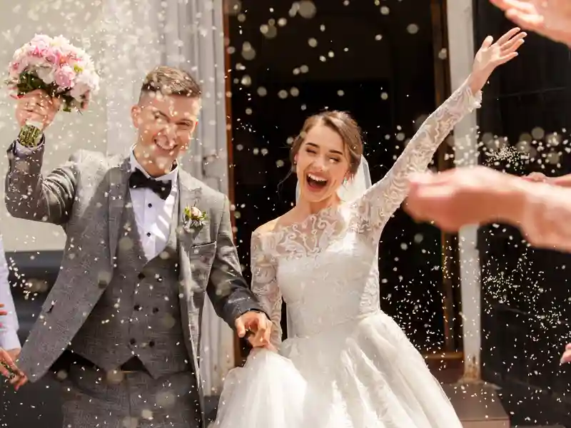 Happy wedding photography of bride and groom at wedding ceremony.