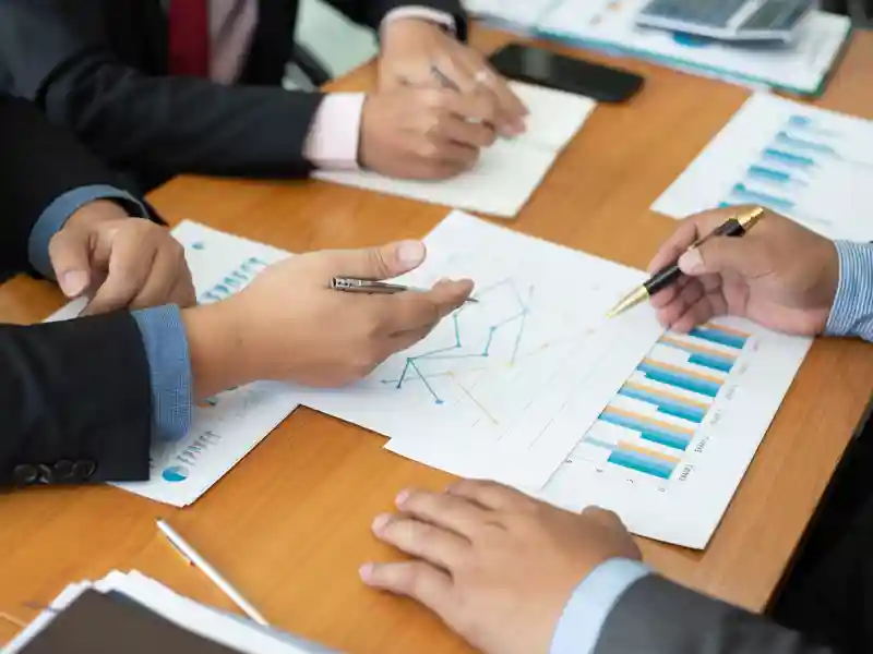 Closeup hand team business analysts make decision