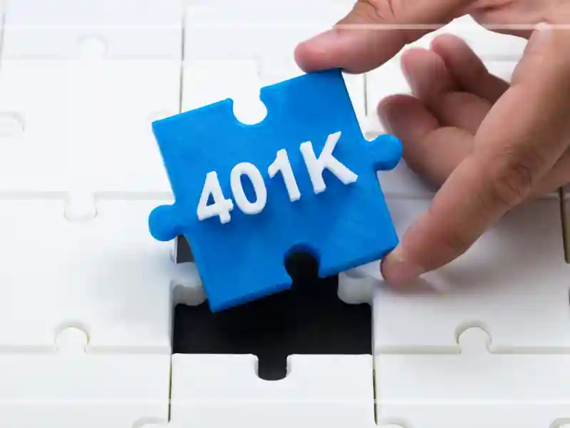 A hand places a blue puzzle piece labeled 401K into a white puzzle with a missing piece.