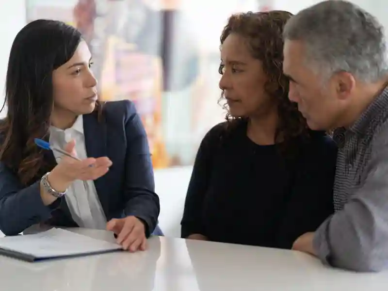 Senior couple talking with a financial advisor.
