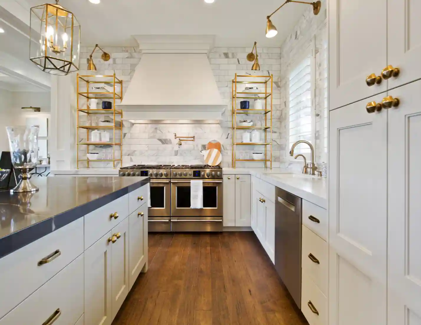 High-end kitchen, with white cabinets and stainless steel appliances.