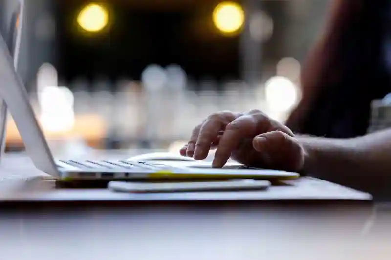 Male hand using laptop