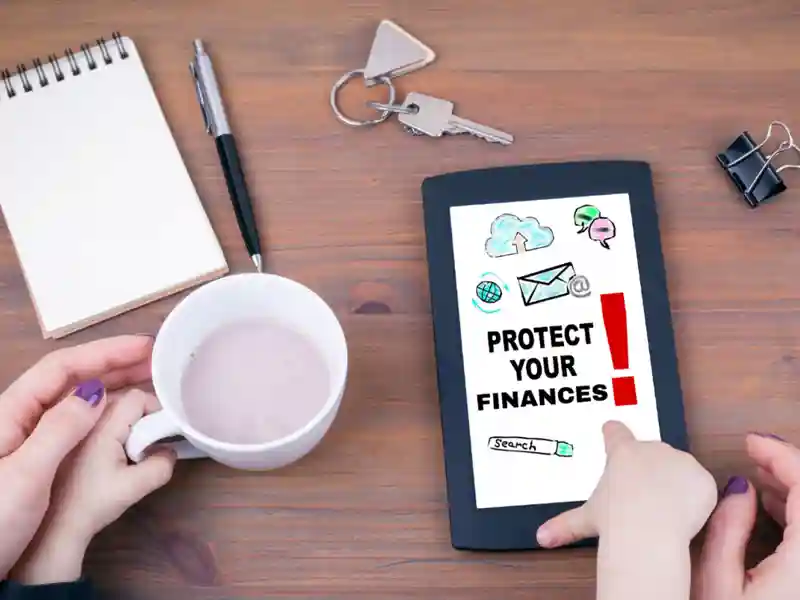 A woman and child holding tea, pointing at a tablet with "Protect Your Finances," surrounded by a notebook, pen, and keys.
